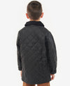 Back view of a child wearing a black quilted jacket on a white background