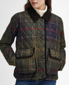 A close-up of a woman wearing a quilted plaid jacket. The jacket features a diamond-quilted pattern in olive green, navy blue, and beige, with red and yellow plaid lines, a dark brown corduroy collar, and front button closures.
