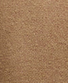 A close-up texture shot of a warm tan or light brown material, showing a fine, granular surface.