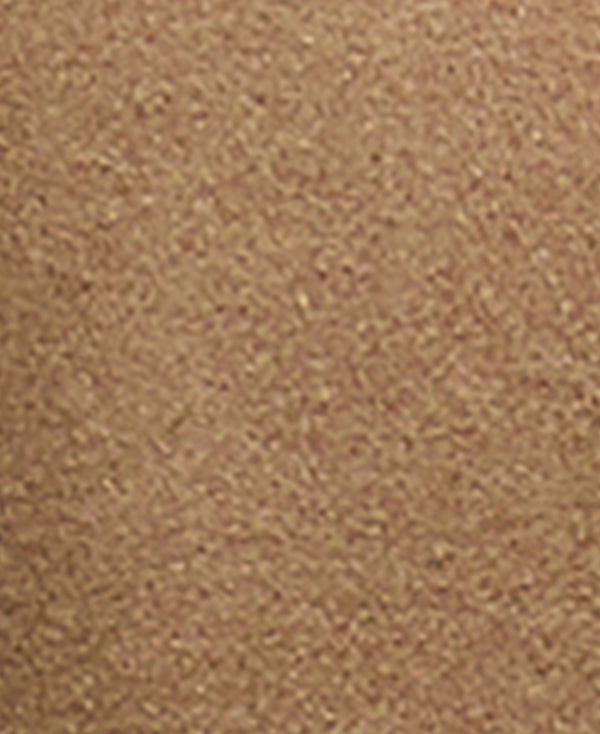 A close-up texture shot of a warm tan or light brown material, showing a fine, granular surface.