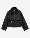 Black quilted wax jacket with gold zippers and buttons on a light gray background.