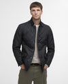 Man wearing a black quilted jacket on a white background