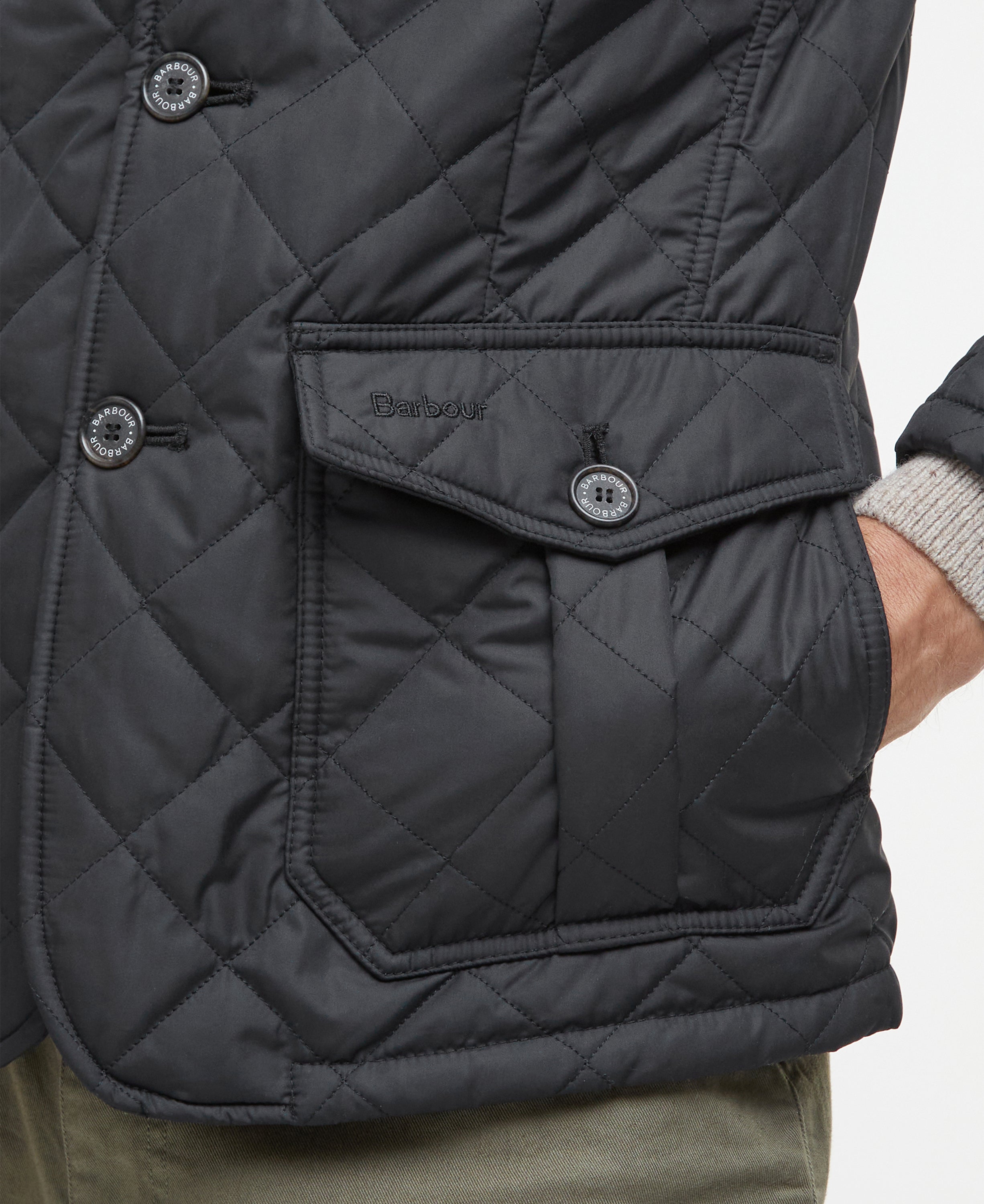 Quilted jacket with diamond pattern and Barbour brand logo on the pocket flap, on a neutral background