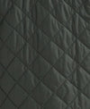 Close-up of a dark gray quilted fabric with a diamond stitching pattern.