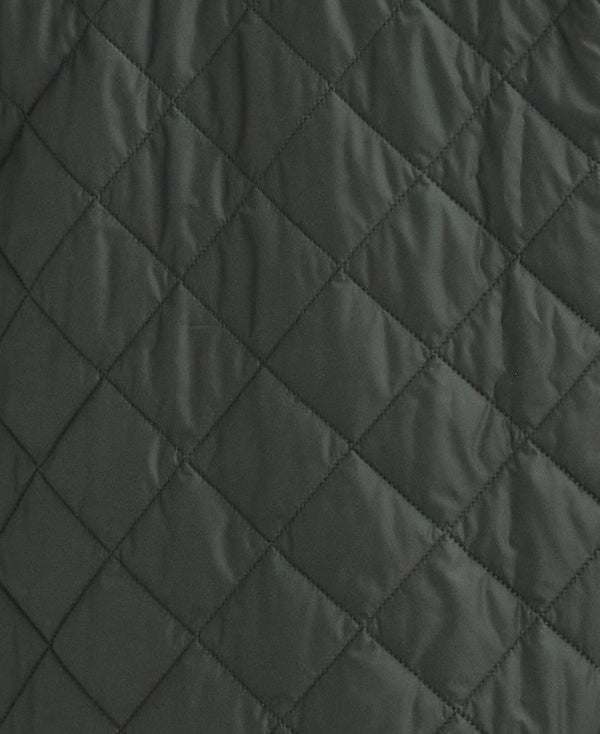 Close-up of a dark gray quilted fabric with a diamond stitching pattern.