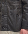 Detail shot of the Barbour Sapper Wax Jacket pocket and stitching.