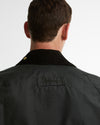 Rear close-up of the Barbour Icons Patch Bedale Wax Jacket showing the corduroy collar, gold snap, and embroidered Barbour patch on the back yoke.