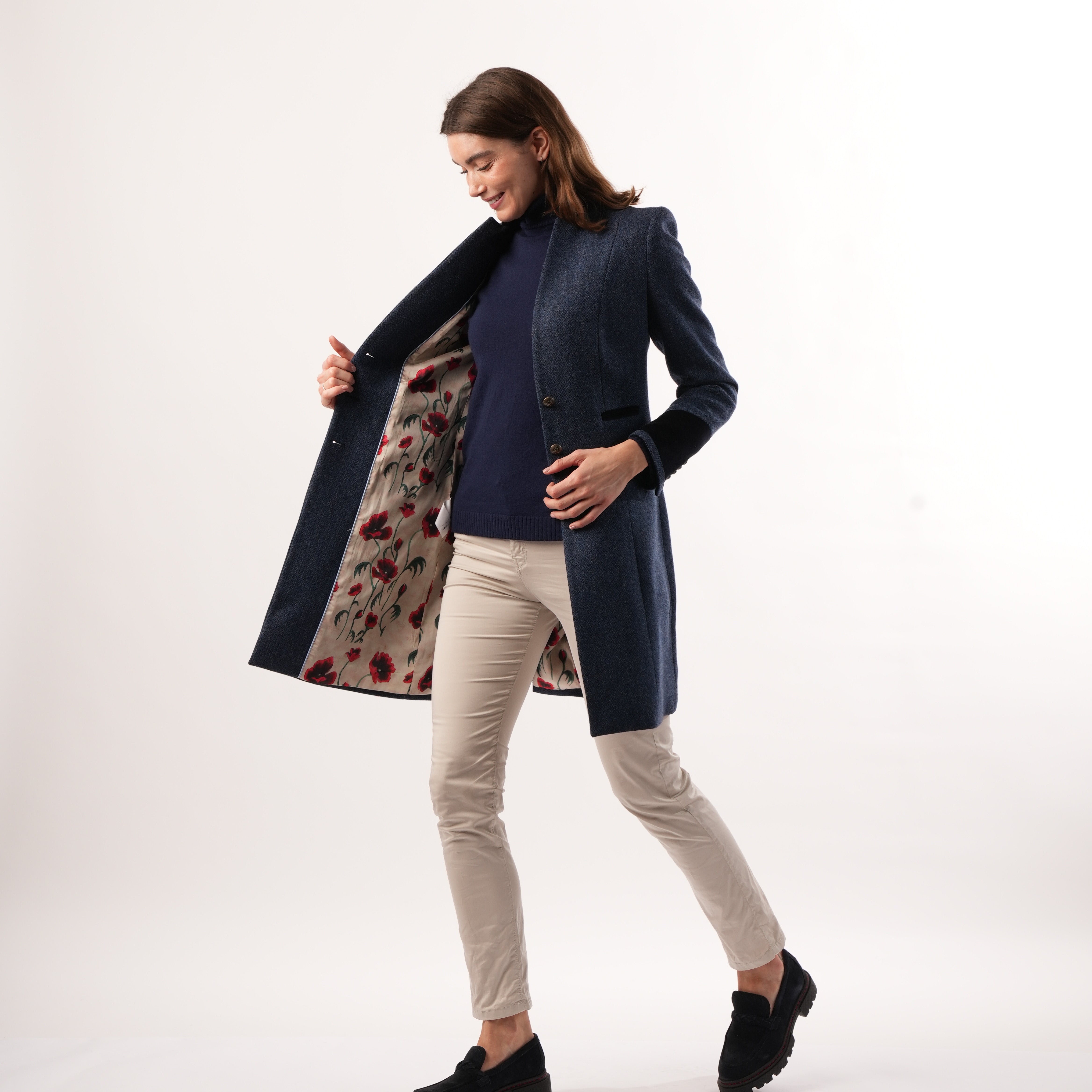 Oxford Navy Coat by Welligogs, worn open to reveal the floral-patterned lining.
