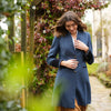 Oxford Navy Coat by Welligogs, closer front view showing the herringbone texture and contrast cuffs.
