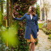 Oxford Navy Coat by Welligogs, buttoned front view showing the defined waist and contrast pocket trims.
