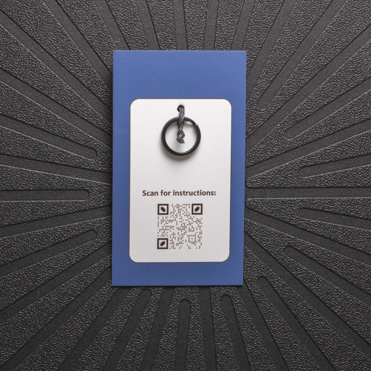 pinsnickety charm back, showing black split ring and qr code