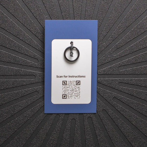 pinsnickety charm back, showing black split ring and qr code